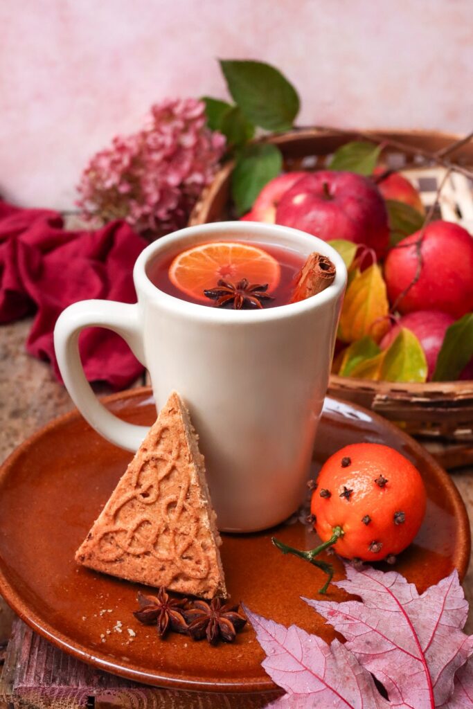 Cinnamon cider and shortbread with apples and orange cloves.