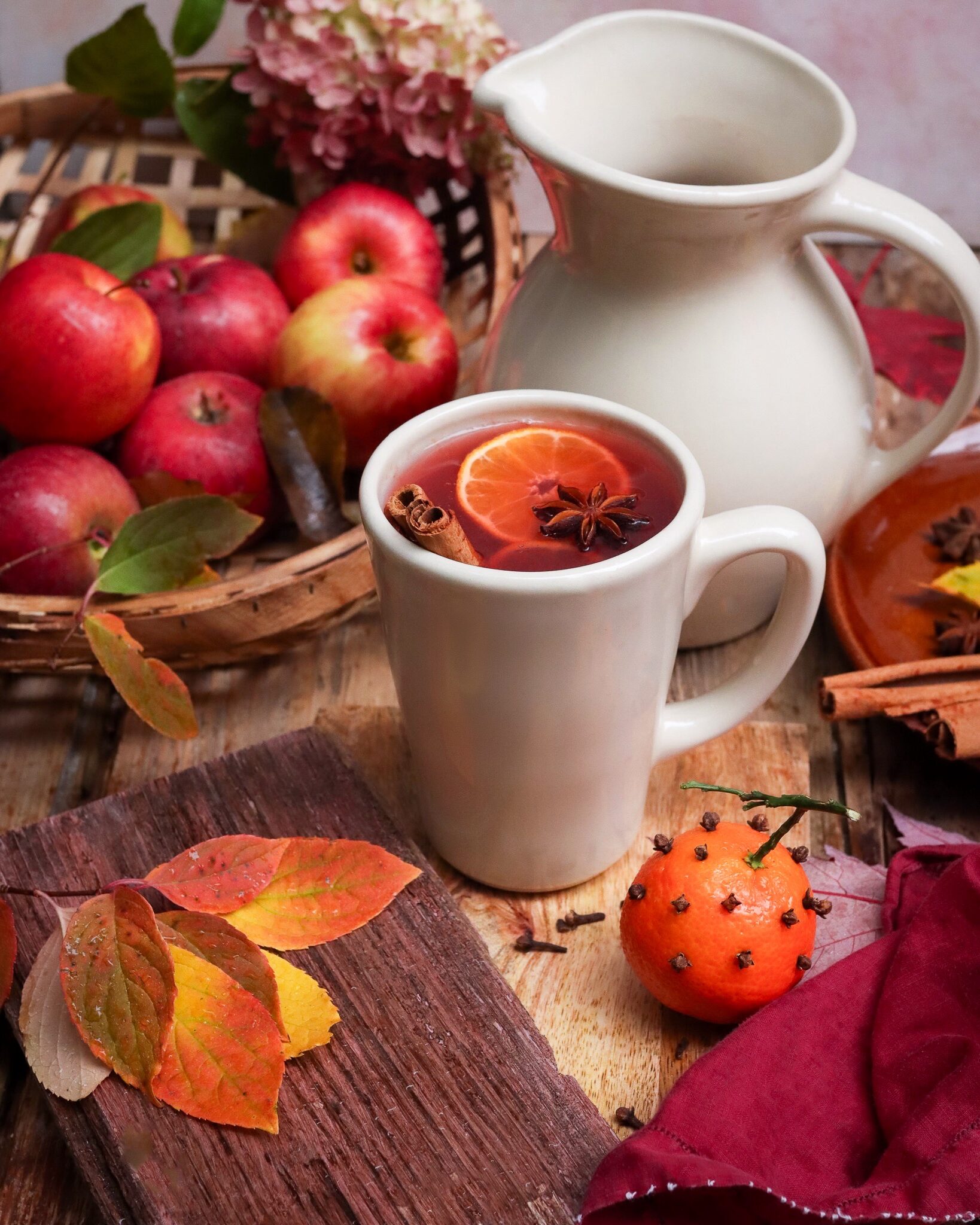 Cinnamon cider with apples and orange cloves.