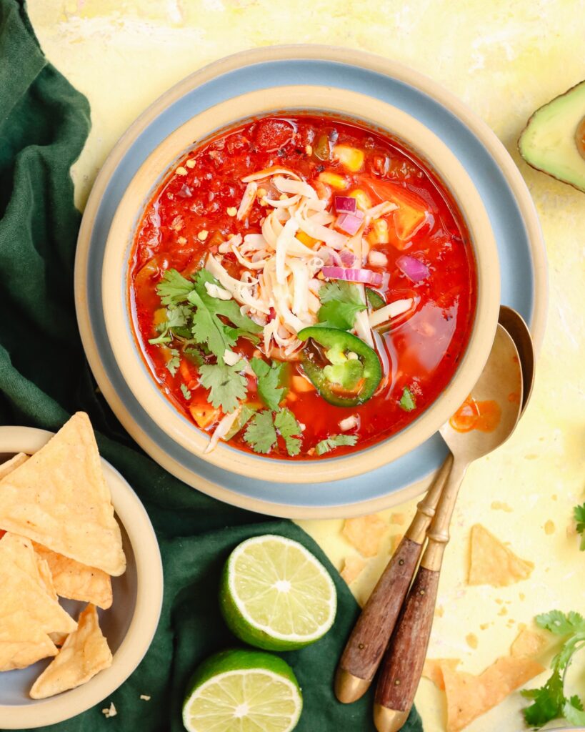 Mexican soup in a Brookline Cereal Bowl with fresh garnishments.